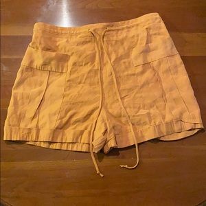Mustard colored high waisted shorts